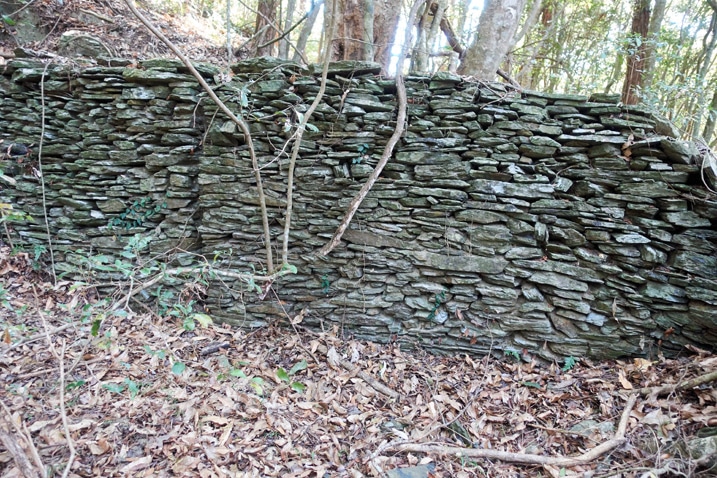 Rocks stacked as a foundation for a traditional style aboriginal structure